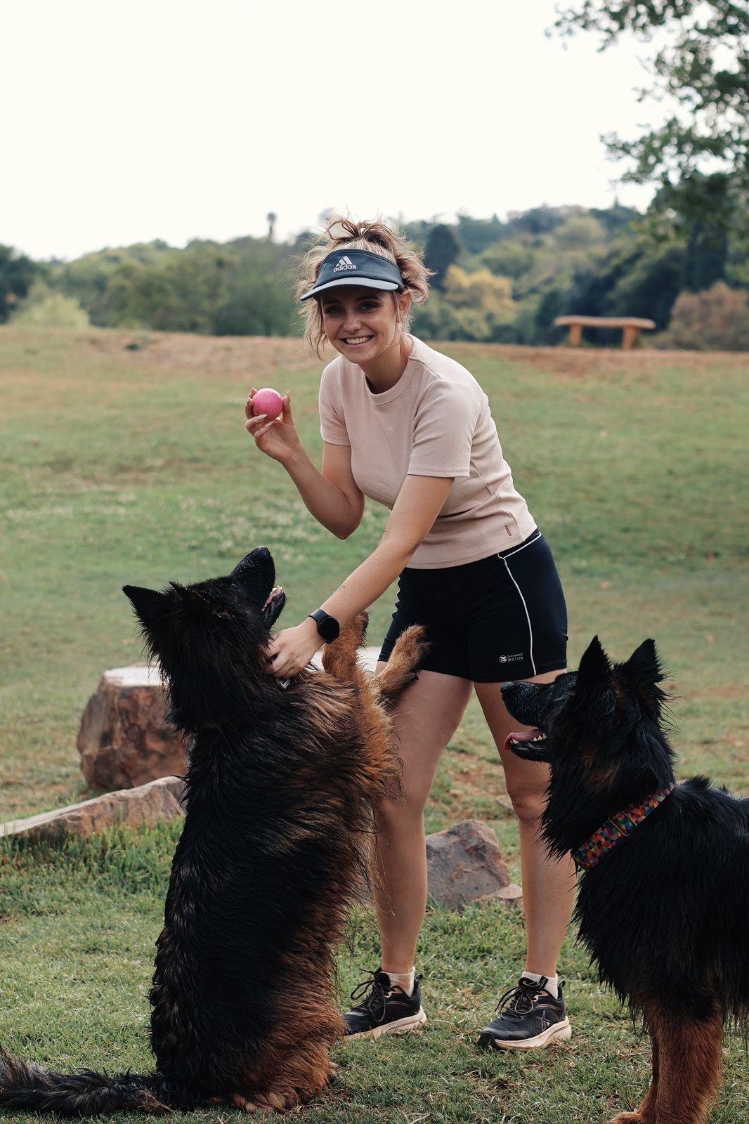 Chane training a german shepherd in a Pretoria park